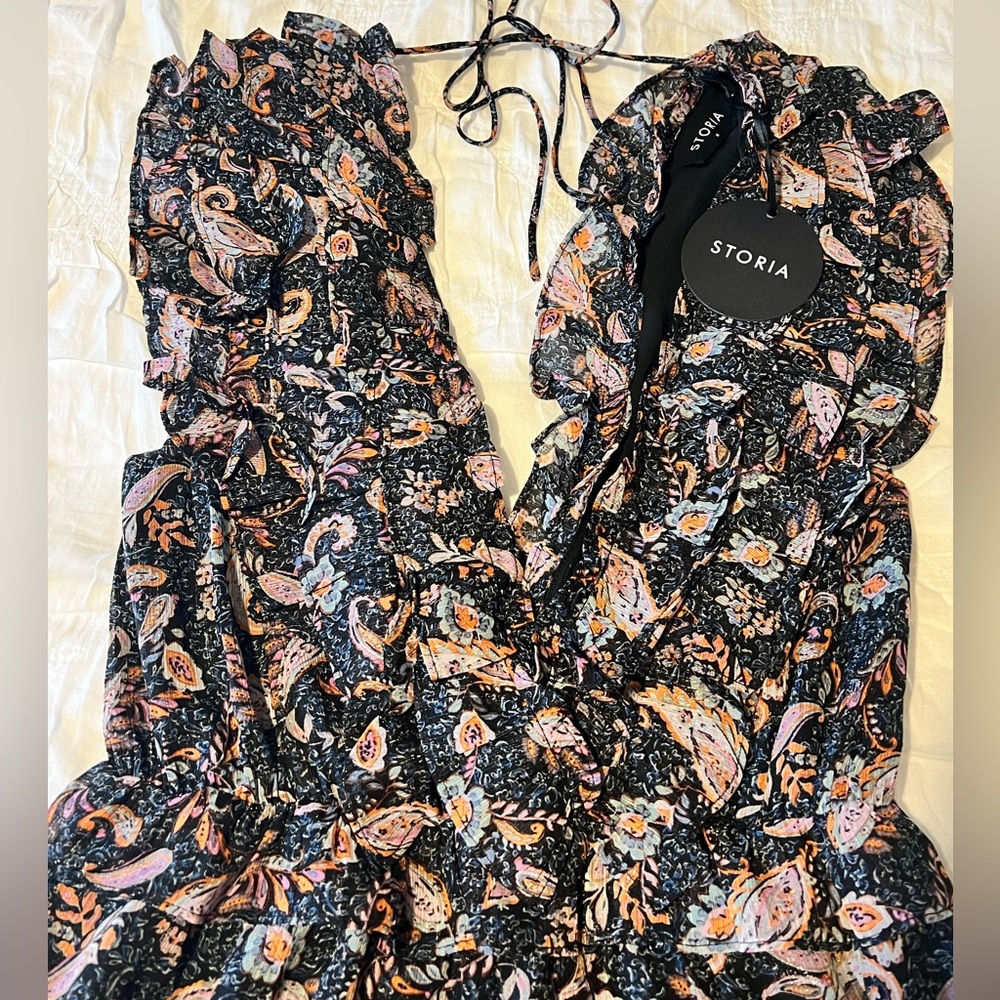 Storia brand, sexy double v-neck jumpsuit. Size medium.